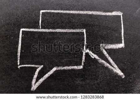 White chalk hand drawing in bubble speech shape with blank space for add text on black board background (Concept for communication
