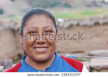 Native american woman laughing. Rural background. 