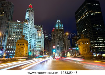 Magnificent Mile with traffic at night, Chicago, IL, USA Royalty-Free Stock Photo #128335448