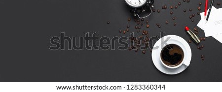 Flat lay cup black coffee, coffee beans black alarm clock red lipstick color pencils white cards on gray dark background top view copy space. Creative Concept time to work, female desktop long banner