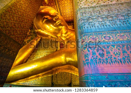 Gold statue reclining buddha indoor of Wat Pho buddhist temple Bangkok Thailand