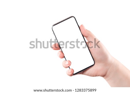 Female hand holding mobile smart phone isolated on white background. Blank white screen. Concept of selfie making photo