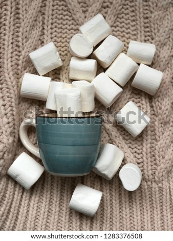 concept winter morning background with cup and  on knitted texture