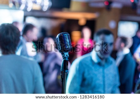 Retro microphone on stage in a pub or Bar (restaurant) during a night show