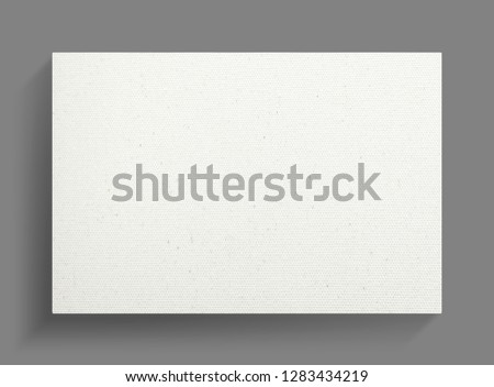 White canvas frame on gray wall background with soft shadow.