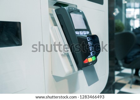 bank card terminal in the mall. payment NFC technology