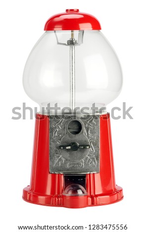 Empty vintage bubble gum distributor or gumball machine, of red color. Viewed in close-up and isolated on white background Royalty-Free Stock Photo #1283475556