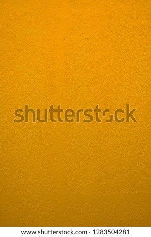 Abstract background image of dark and fresh orange color paint concrete wall.Faded glow design from orange color soft light backdrop bright clear with blank space.