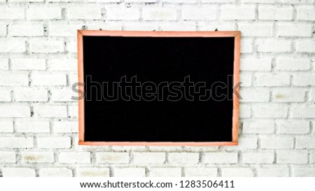 Empty black board. black board on white brick wall texture background. 