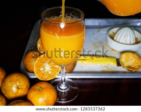 freshly squeezed orange juice in glass