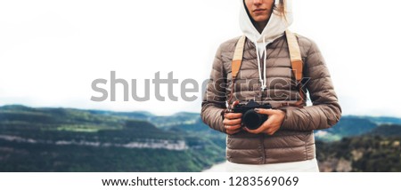 photographer traveler on green top on mountain, tourist look enjoy nature panoramic landscape in trip, girl holding in hands photo camera, hiker taking click photography, relax holiday hobby concept