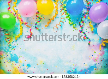 Festival, carnival or birthday party frame with balloons, streamers and confetti on colorful background with copy space