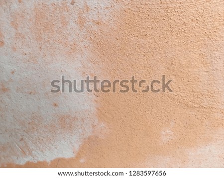 Old orange cement wall background and texture
