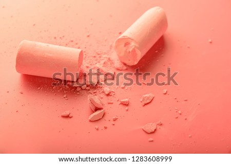 Crushed chalk on coral background