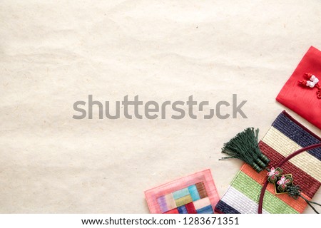 Korea traditional object on the Korea traditional paper. lucky bag, wrapped present Royalty-Free Stock Photo #1283671351