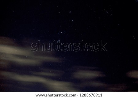 Orion constellation with cloud trails