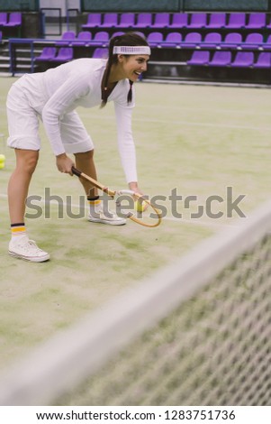 young woman playing tennis