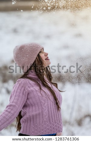 girl in pink jacket photo shoot in winter