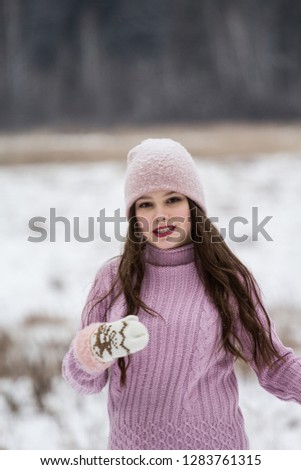girl in pink jacket photo shoot in winter