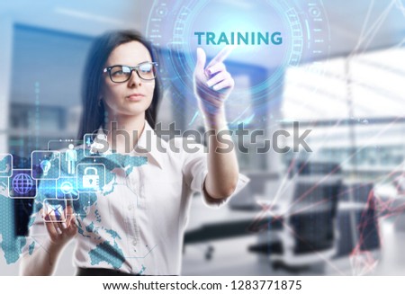 The concept of business, technology, the Internet and the network. A young entrepreneur working on a virtual screen of the future and sees the inscription: Training