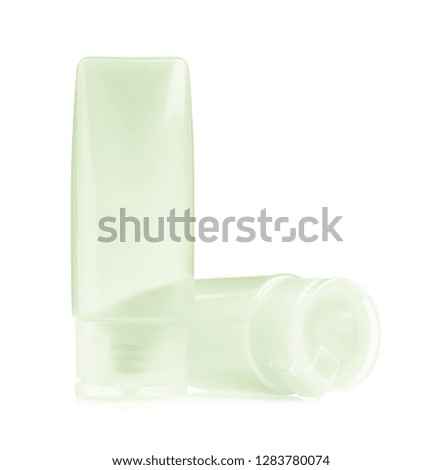 travel toiletries, small plastic bottles of hygiene products  isolated on white background