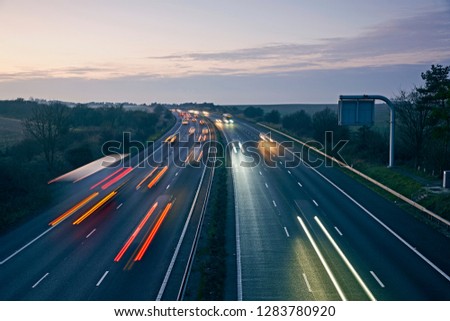 M4 motorway in Wiltshire illuminated at dusk with long exposure Royalty-Free Stock Photo #1283780920