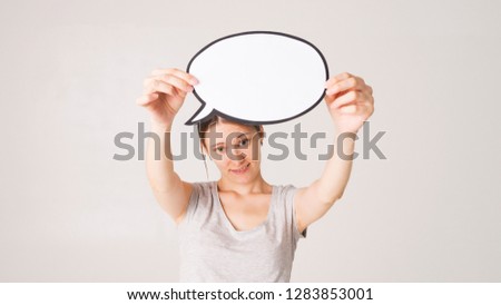woman holding blank speech bubble