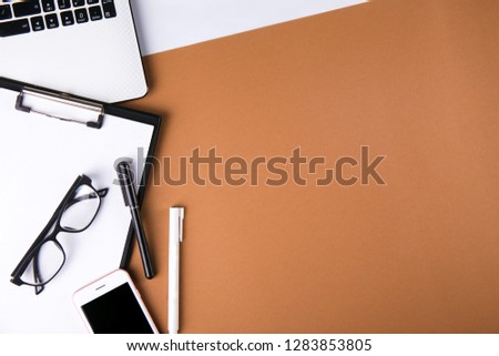 Content creator table concept. Laptop computer, modern wireless electronic gadget, supplies on clean desktop. Background, copy space, close up, flat lay, top view. Creative writer's neat workspace.
