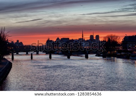 Sunrise over ile de la Cite in winter with Pont des Arts in foreground - Paris, France. HDR Photo from Pont du Carrousel.