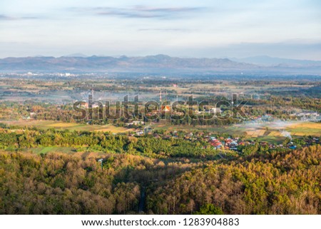 Top view of Prathat Cho Hae temple with native village in Phrae province, Thailand.