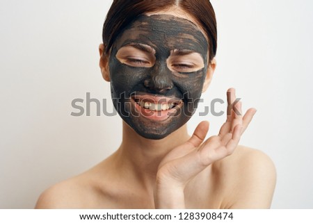 young woman in clay mask portrait