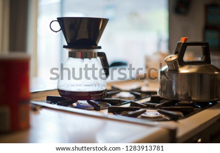 Coffee pot sitting on an oven element.