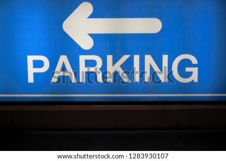 Parking and arrow sign to the car park.