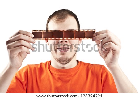 serious man with film strip before the eyes isolated on white symbol photographer, film fandirector film editing analog film, glasses 3 d effect, the idea of ??theater, illusion, visual distortion