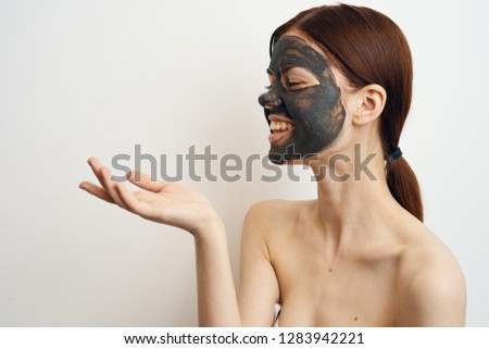 woman smiling on face clay mask on hand place free