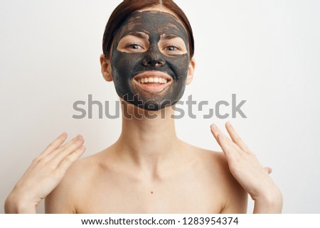 woman smiling on face clay cosmetic mask care
