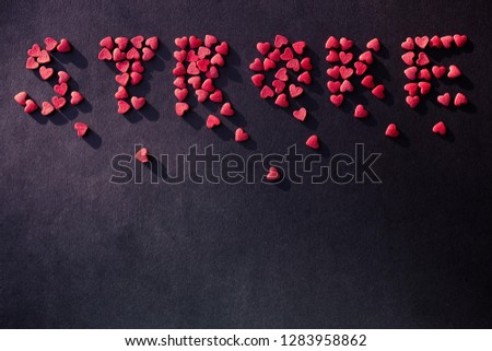 Cardiology, heart disease, stroke. Red inscription on a dark background. Copy space, vignetting.