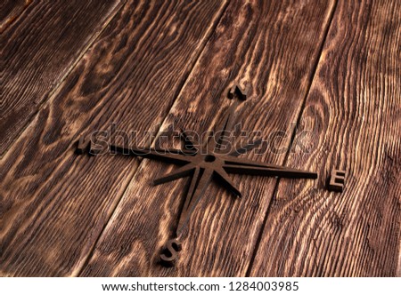 wood texture. background old panels with wooden compass