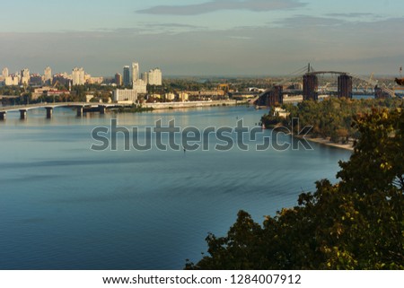 Morning in the capital of Ukraine, the city of Kiev overlooking the Pechersk Lavra, the Dnipro river and the panorama of the magnificent city.