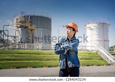 Portrait of woman in protective glasses and Hard Hat in gas industry.