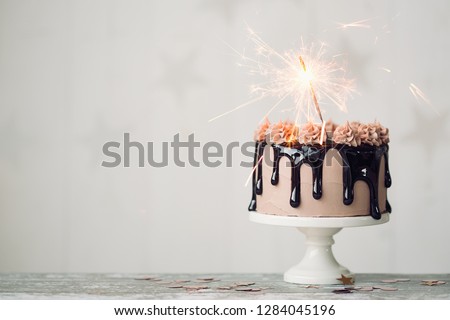 Chocolate drip cake with sparkler for a birthday or celebration