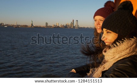 Young and beautiful woman on a ferry in New York