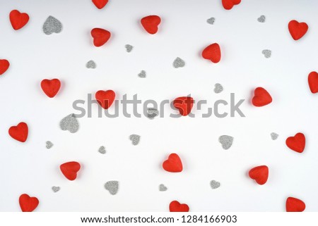 Many red and silver hearts on white background. Valentines Day