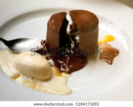 Macro photo of delicious sweet chocolate pie with ice cream on white table