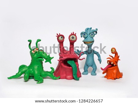 A group of four cartoon monsters bacteria. Plasticine characters on a white background.
 Royalty-Free Stock Photo #1284226657