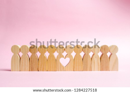 Two figures of people in a row form a void in the shape of a heart. Concept of love and search for the second half. Find a soul mate and start a family. Love and romance, real secret feelings Royalty-Free Stock Photo #1284227518