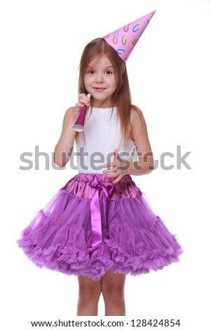 Image of adorable princess for christmas card isolated over white/Girl wearing white top and bright purple tutu skirt
