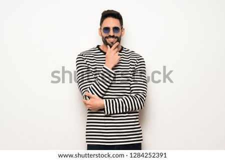 handsome man with striped shirt with glasses and smiling