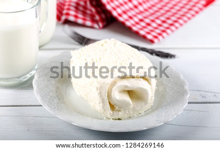 Clotted cream (butter cream) for Turkish breakfast / Kaymak and glass of milk Royalty-Free Stock Photo #1284269146