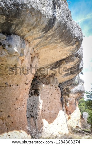 A photo of rocks beautifully shaped by erosion and weather in the Enchanted city, or Ciudad Encantada, which is a natural park and geological site near the city of Cuenca, in Castilla-La Mancha, Spain